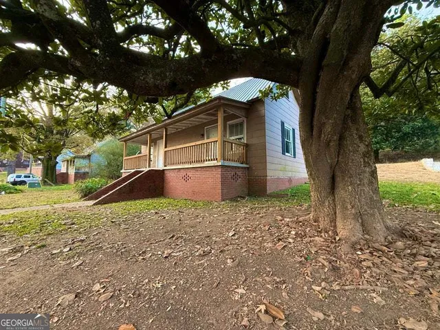 a backyard of a house with lots of green space