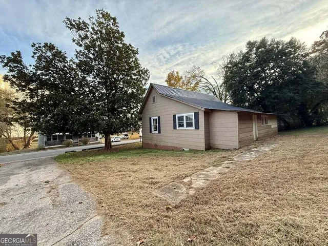 a backyard of a house with lots of green space
