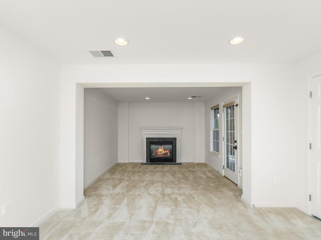 118 Short Branch Road Stafford, VA 22556 - Photo 7 of 39 Gas fireplace adds coziness to the rec room.