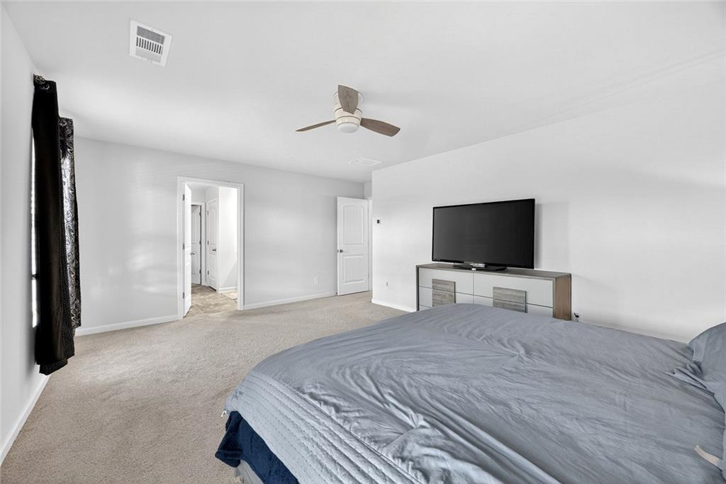 56 Berwick Crossing Dallas, GA 30157 - Photo 16 of 28 a bedroom with a bed and a flat screen tv