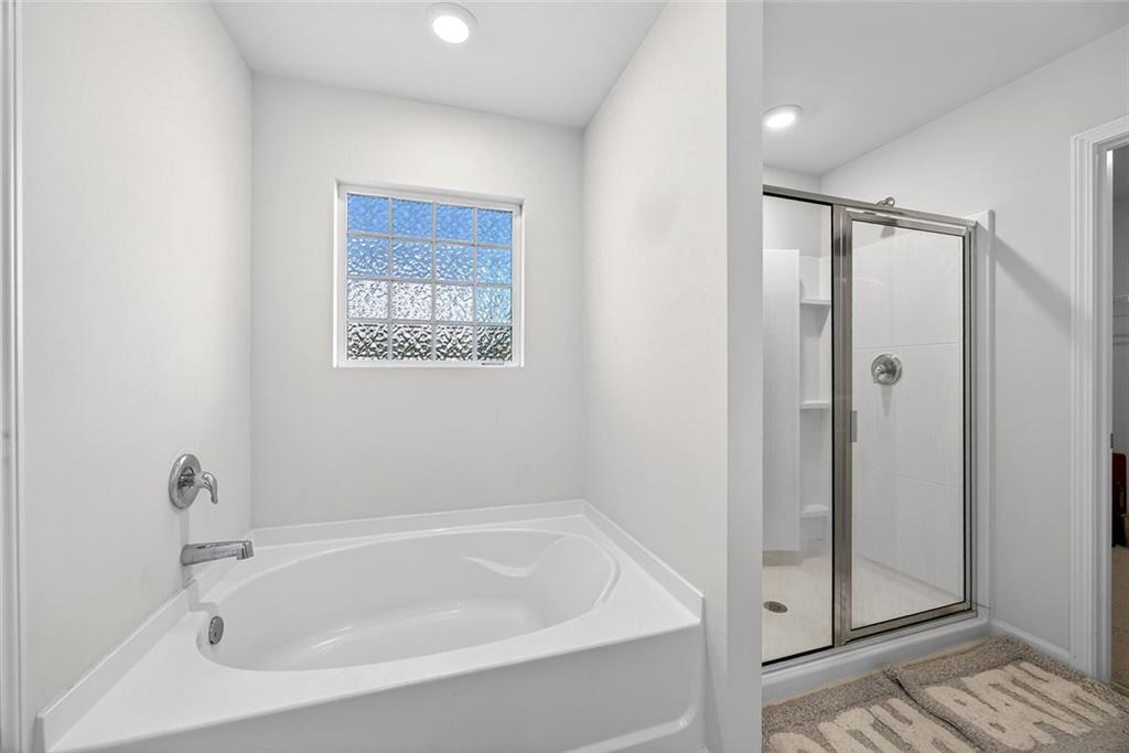 56 Berwick Crossing Dallas, GA 30157 - Photo 20 of 28 a white bath tub sitting next to a shower