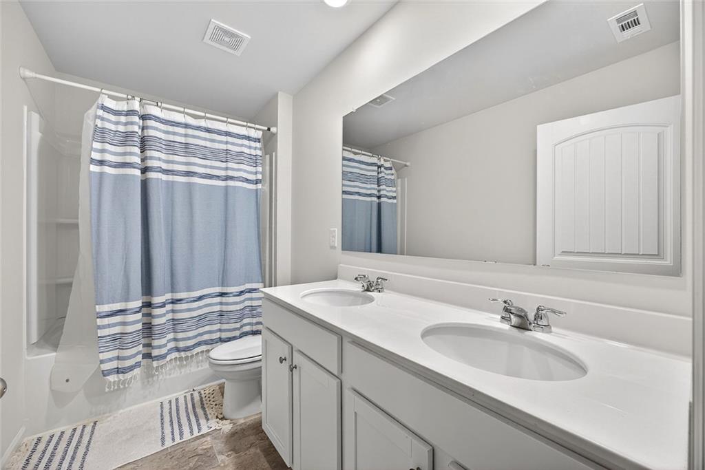 56 Berwick Crossing Dallas, GA 30157 - Photo 22 of 28 a bathroom with a sink and a mirror