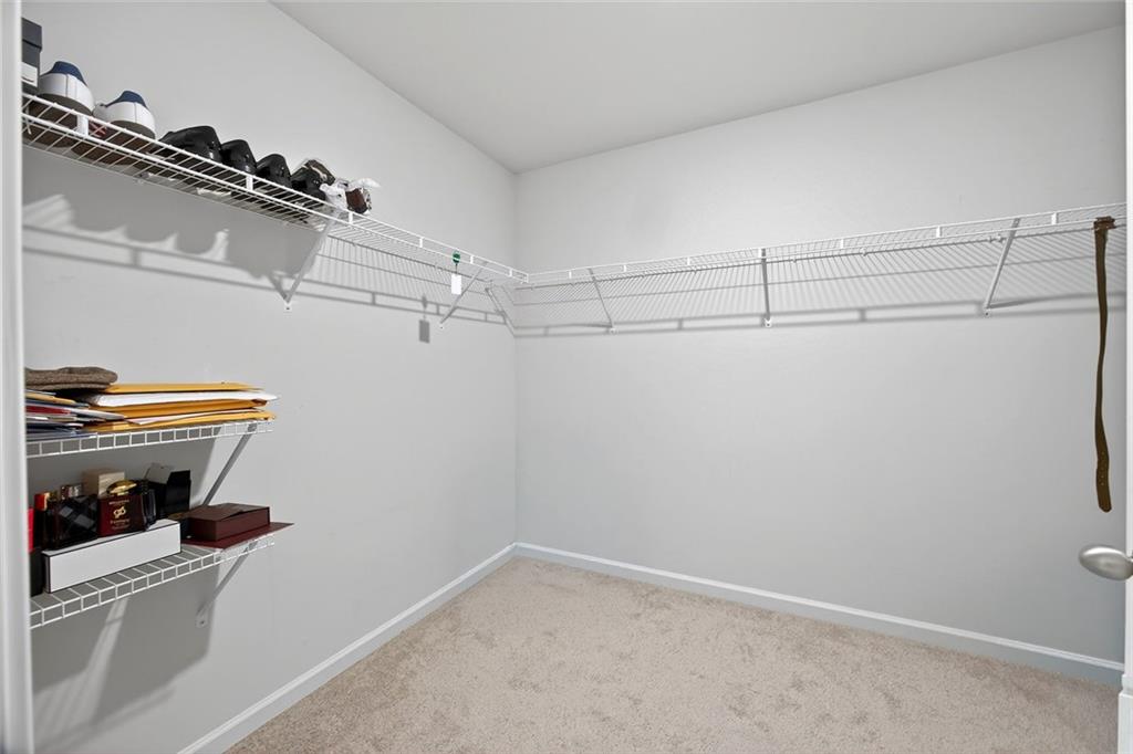 56 Berwick Crossing Dallas, GA 30157 - Photo 23 of 28 a view of storage and utility room with racks on the wall