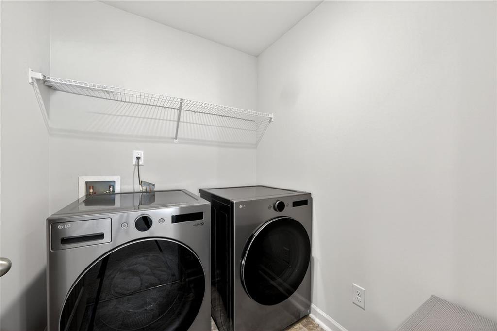 56 Berwick Crossing Dallas, GA 30157 - Photo 24 of 28 a utility room with dryer and washer