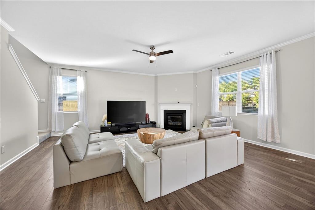 56 Berwick Crossing Dallas, GA 30157 - Photo 10 of 28 a living room with furniture a fireplace and a flat screen tv