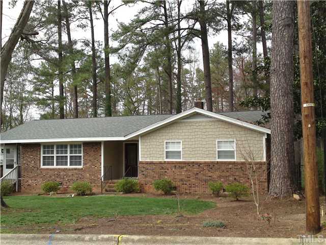 3608 Anclote Place Raleigh, NC 27607 - Photo 1 of 8 a front view of a house with garden