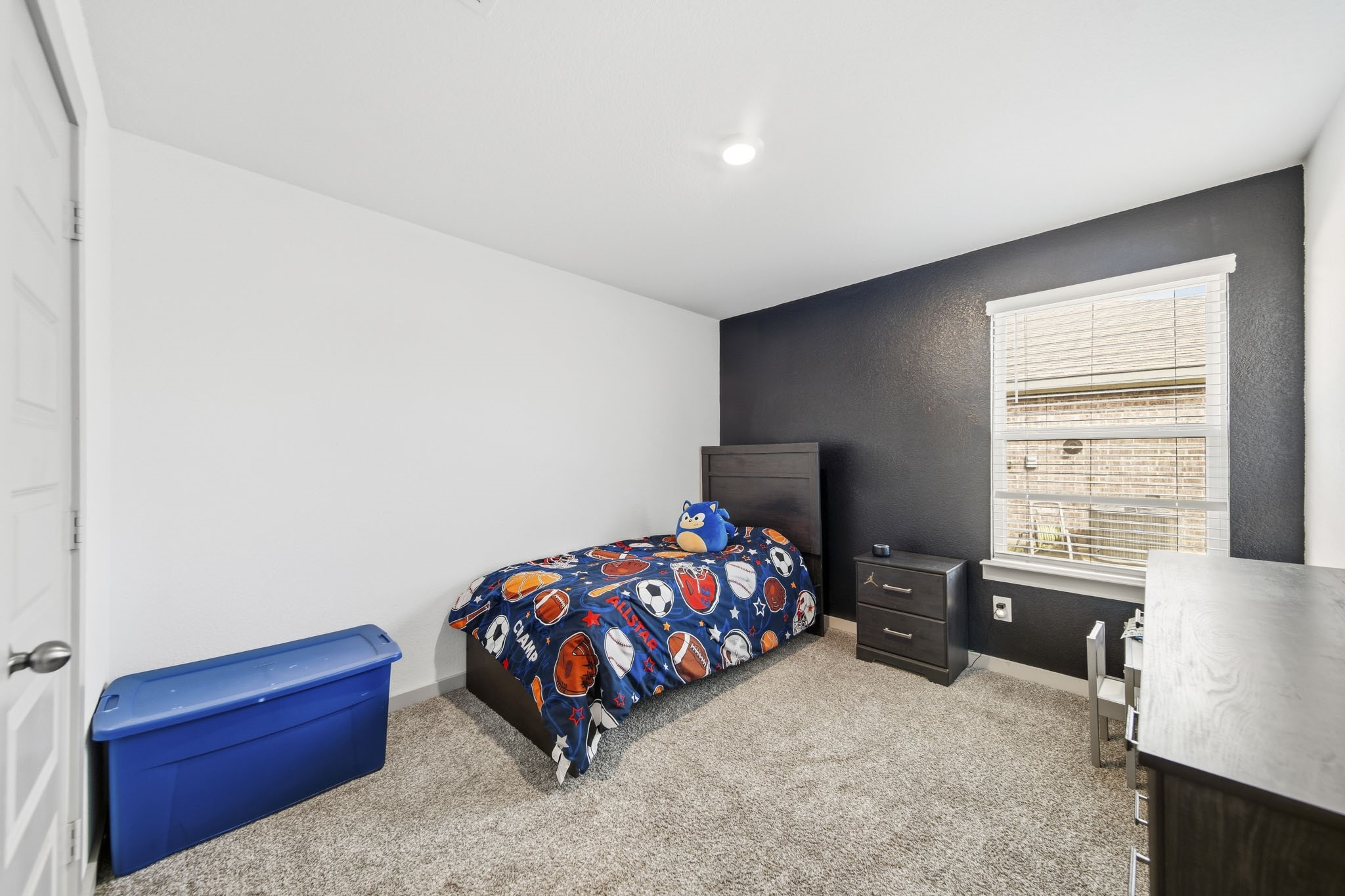 8210 Buck Lane Rosharon, TX 77583 - Photo 23 of 30 Cozy secondary bedroom with ample space for furniture and storage.