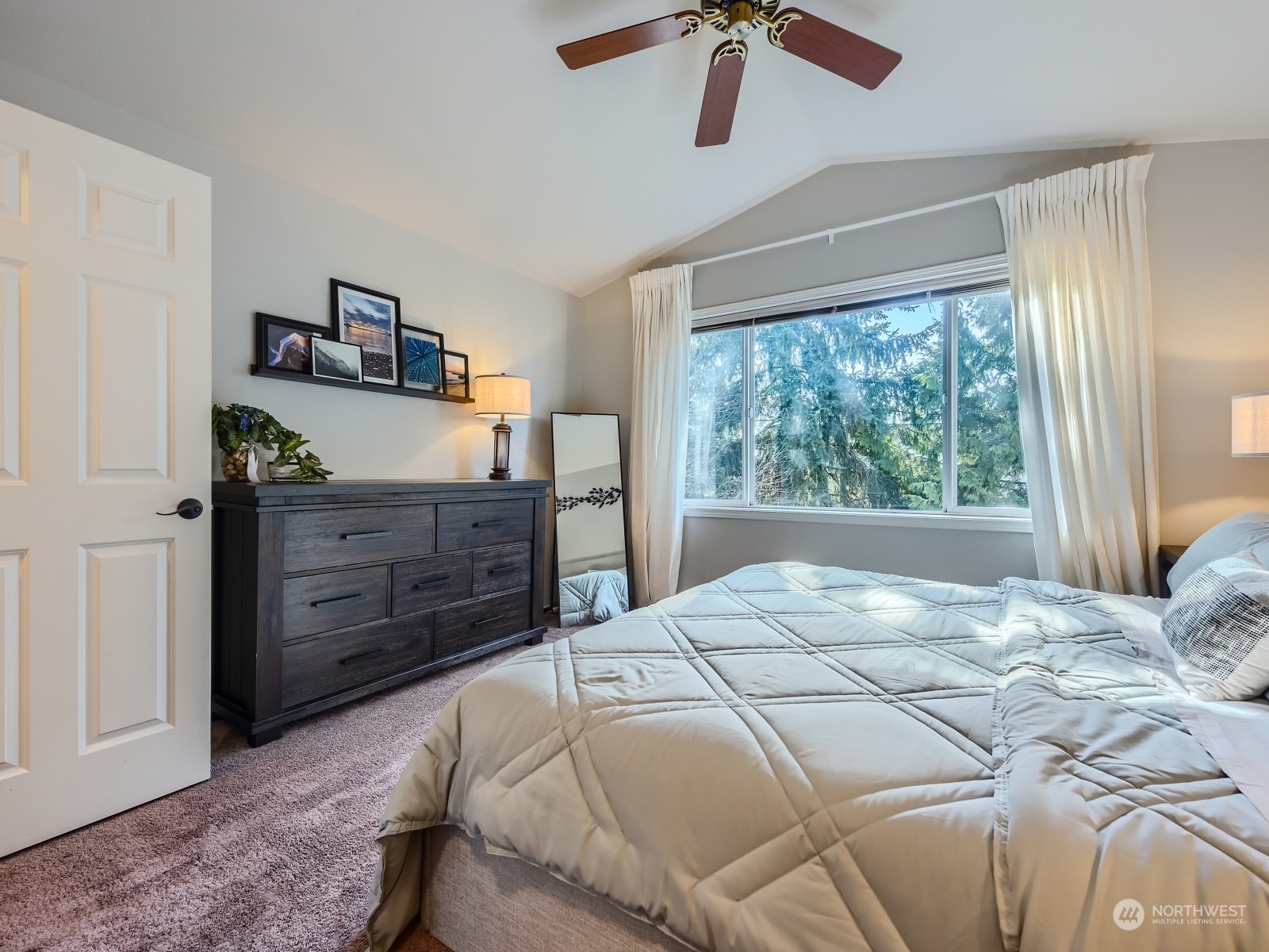 4821 Northeast 5th Street Renton, WA 98059 - Photo 15 of 26 a bedroom with a bed and a dresser