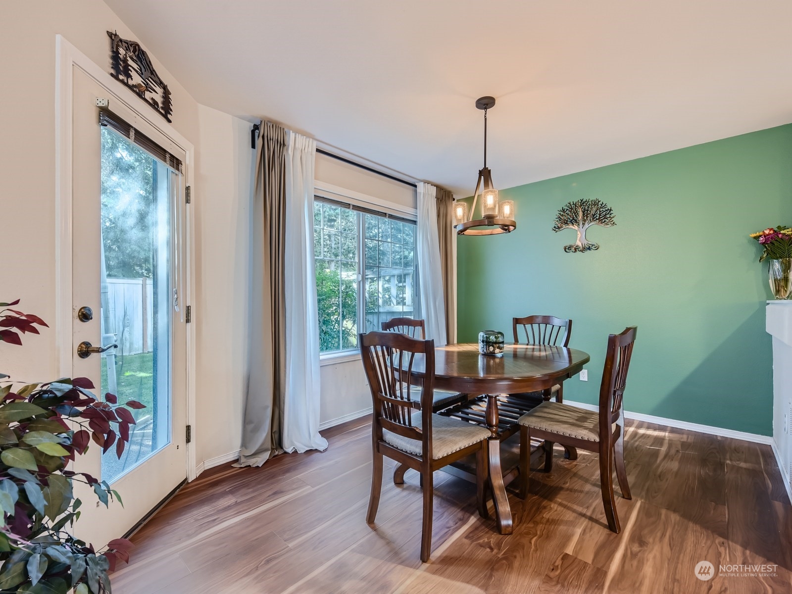 4821 Northeast 5th Street Renton, WA 98059 - Photo 5 of 26 a view of a dining room with furniture window and wooden floor
