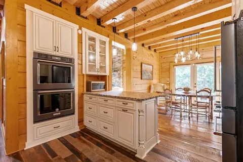 a view of a deck with wooden floor and seating space