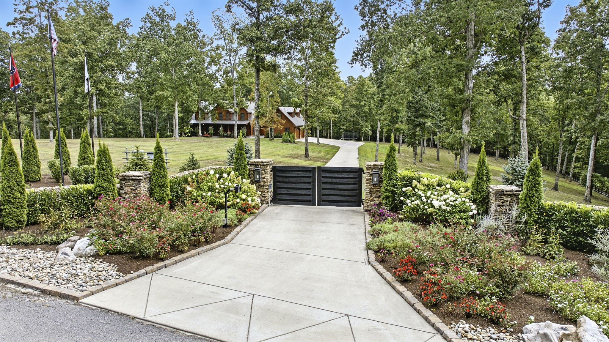 6011 Garrison Springs Road Franklin, TN 37064 - Photo 95 of 99 a view of a garden with wooden bench