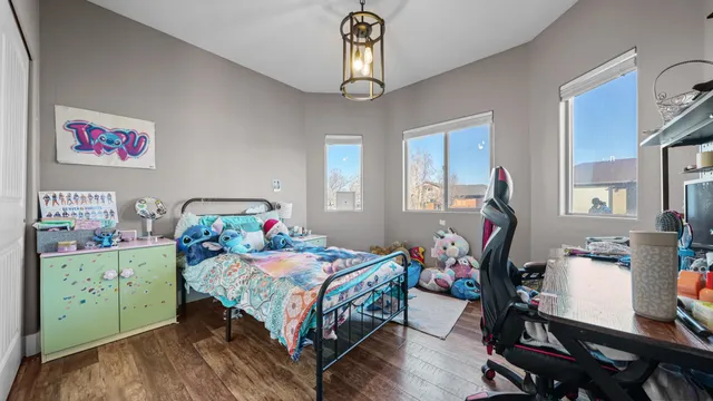a bedroom with a bed closet and a window