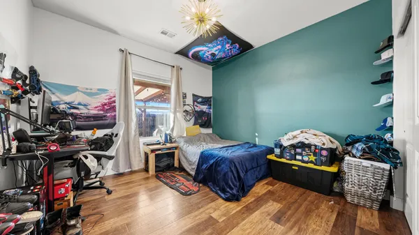 a bedroom with furniture and a bed