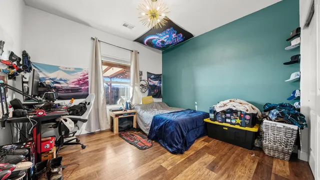 a bedroom with furniture and a bed