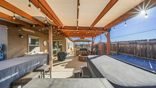 a view of a living room with a lot of furniture and floor to ceiling window