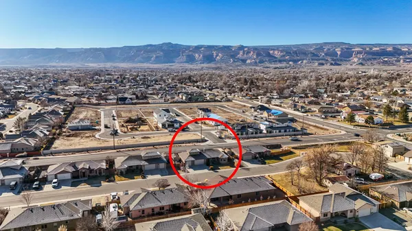 an aerial view of a house with a ocean view