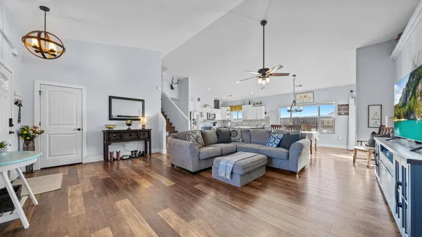 a living room with furniture and a table