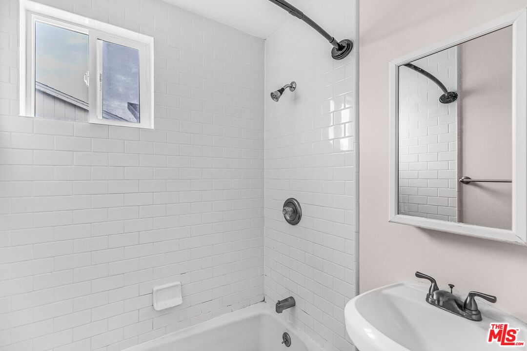 3996 Berryman Avenue Los Angeles, CA 90066 - Photo 12 of 17 a bathroom with a sink a toilet and shower