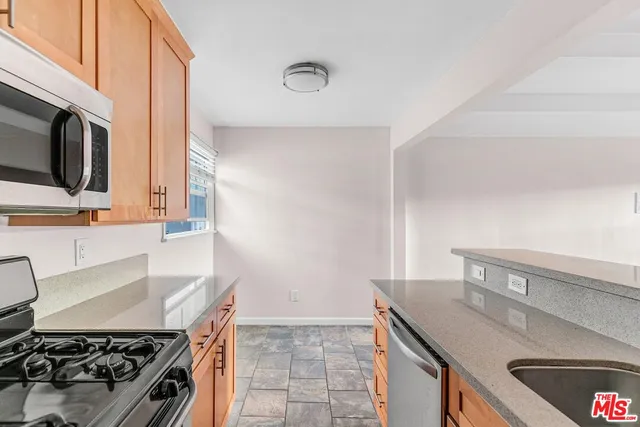 a kitchen with a stove and a sink