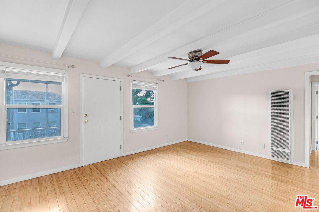 3996 Berryman Avenue Los Angeles, CA 90066 - Photo 6 of 17 wooden floor in an empty room with a window