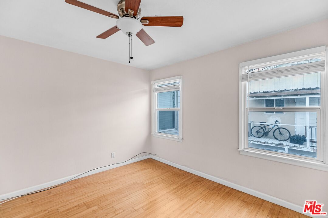 3996 Berryman Avenue Los Angeles, CA 90066 - Photo 8 of 17 a view of an empty room with window and wooden floor