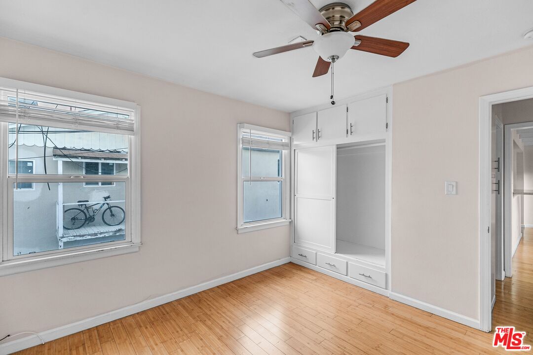 3996 Berryman Avenue Los Angeles, CA 90066 - Photo 9 of 17 a view of an empty room with a window and wooden floor