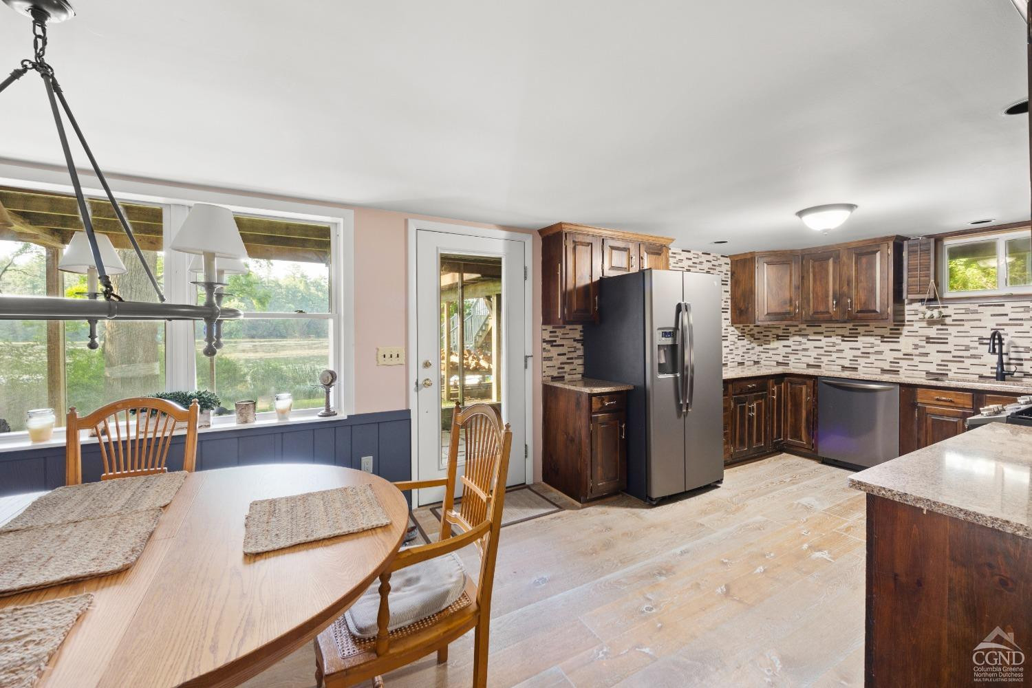 1264 Lakeview Road Copake, NY 12516 - Photo 7 of 24 a kitchen with stainless steel appliances granite countertop a refrigerator a sink a stove and island