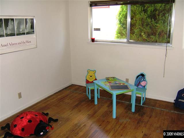 2090 Ives Avenue Reno, NV 89503 - Photo 9 of 9 a view of a workspace with furniture and wooden floor