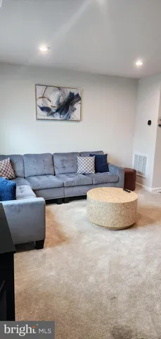 a living room with furniture and a couch