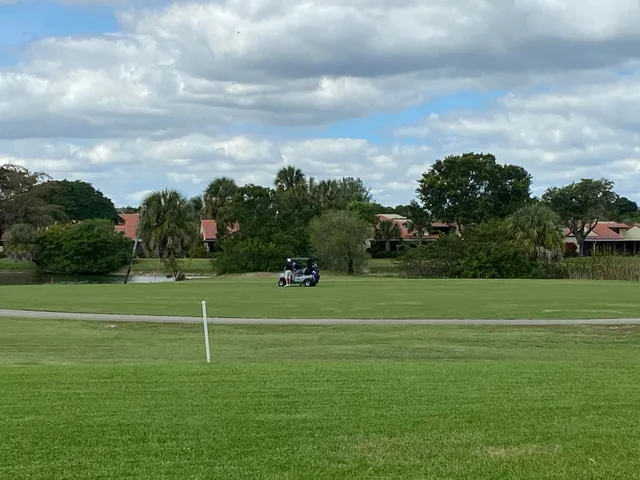 a view of a golf course with a big yard