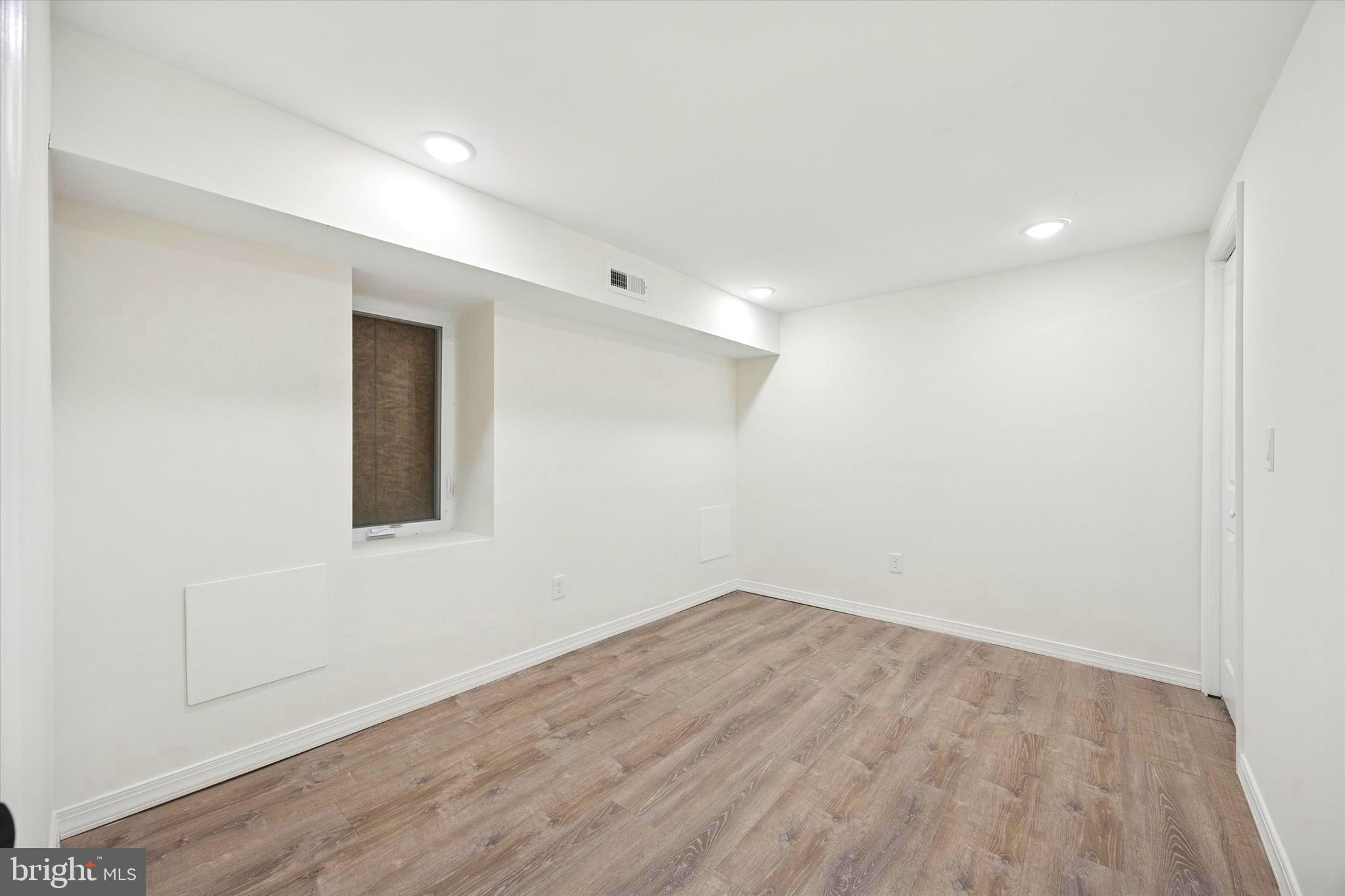 1326 North Frazier Street Philadelphia, PA 19131 - Photo 33 of 40 a view of empty room with wooden floor and fan