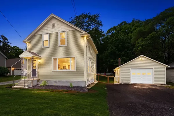 a front view of a house with a yard