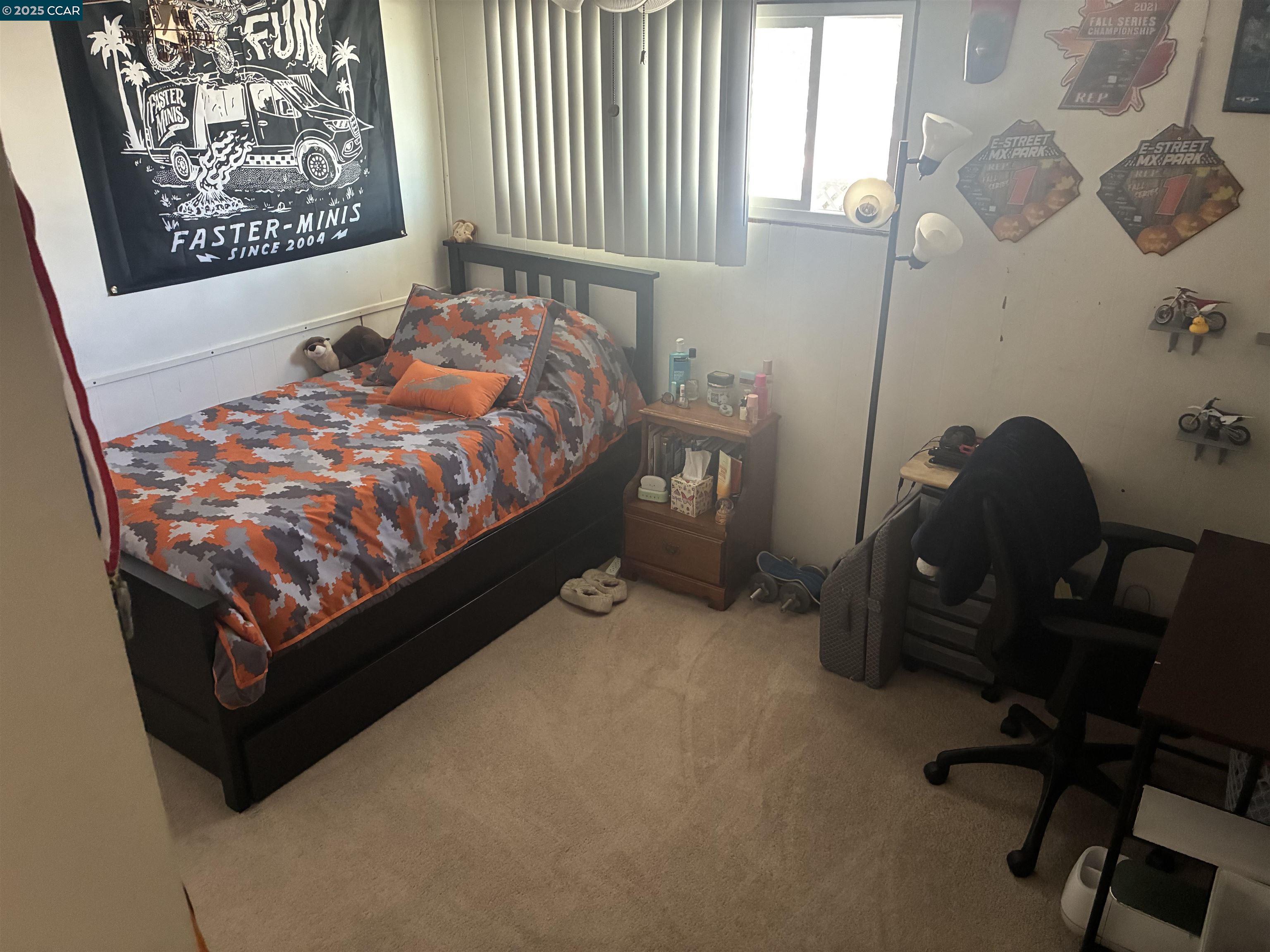 261 Tanbor Way, Unit 229 Pacheco, CA 94553 - Photo 7 of 14 a bed sitting in a bedroom next to a window