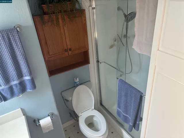 a bathroom with a toilet and a sink