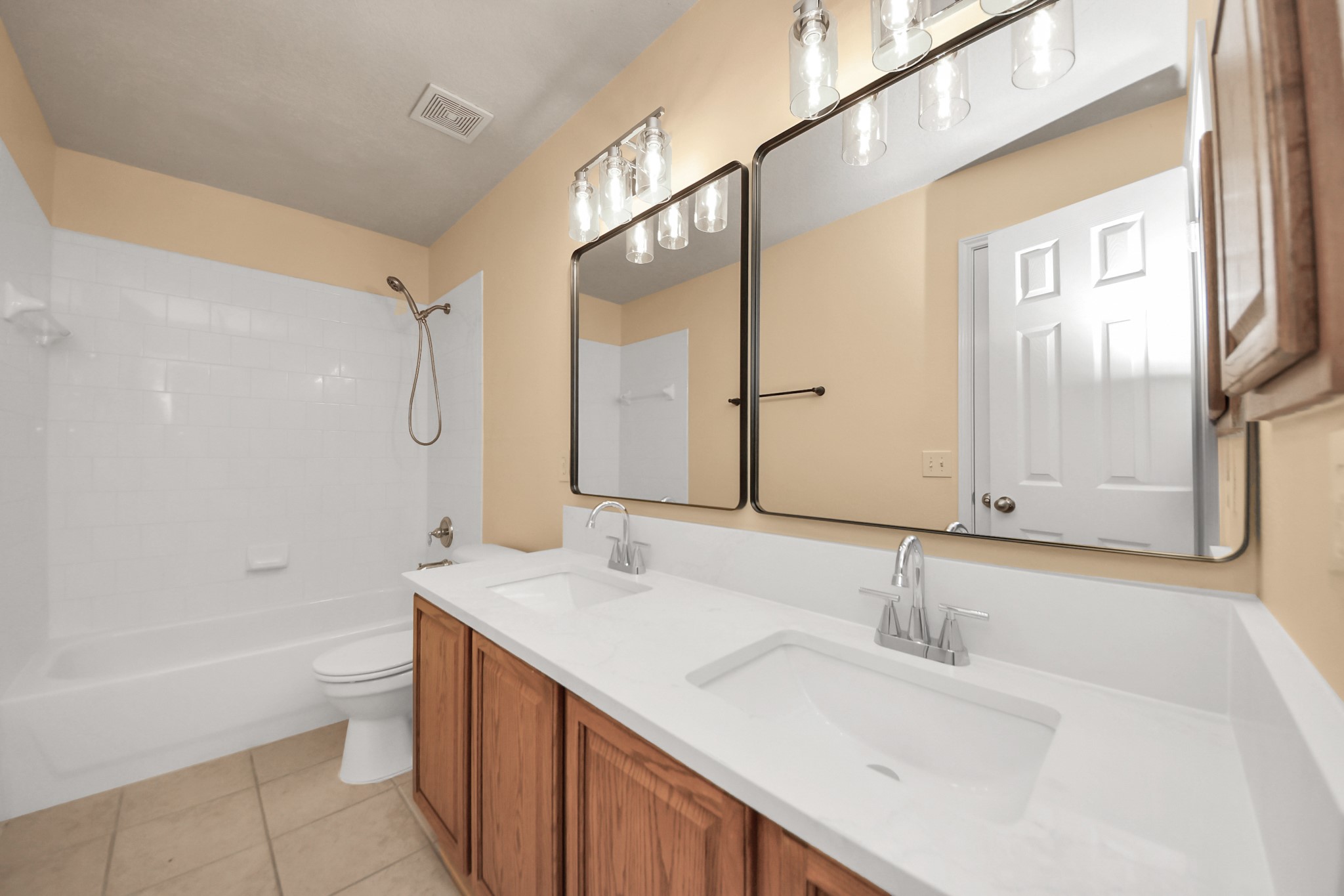 20011 Rosswood Lane Spring, TX 77388 - Photo 11 of 26 a bathroom with a sink a toilet and shower