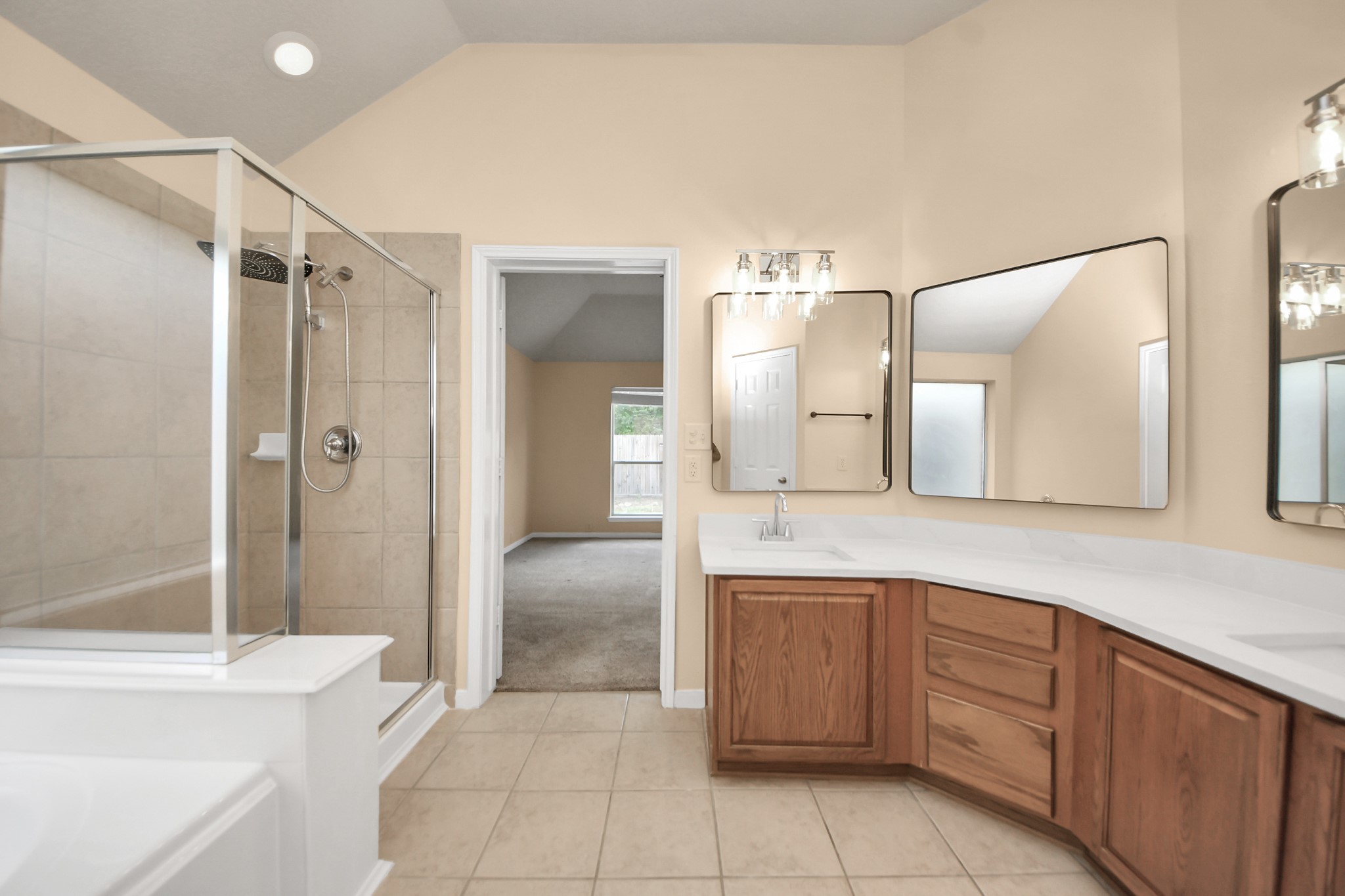 20011 Rosswood Lane Spring, TX 77388 - Photo 18 of 26 a bathroom with a granite countertop sink mirror and shower