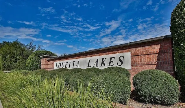 a view of a street with a building in the background