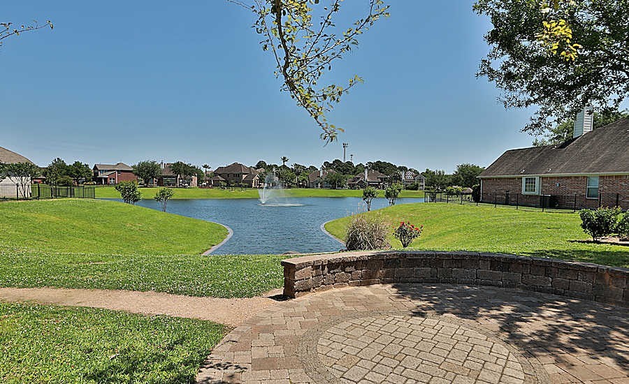 20011 Rosswood Lane Spring, TX 77388 - Photo 24 of 26 a view of a garden with a lake