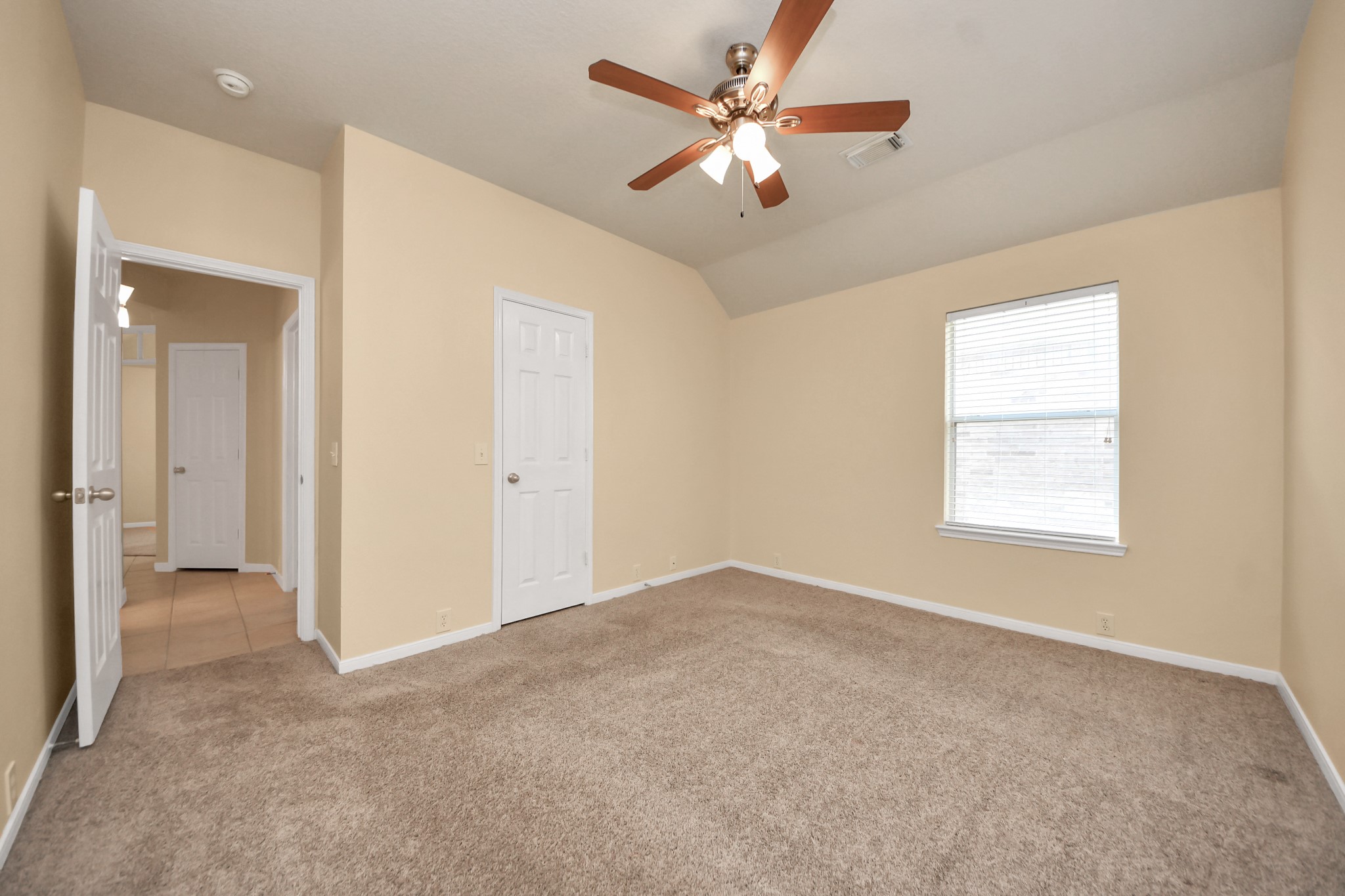 20011 Rosswood Lane Spring, TX 77388 - Photo 9 of 26 an empty room with chandelier fan and windows