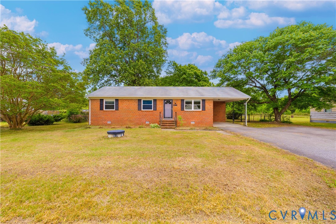 2713 Irwin Road Prince George, VA 23875 - Photo 1 of 26 a view of a house with pool and a yard