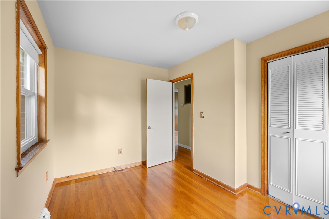 2713 Irwin Road Prince George, VA 23875 - Photo 11 of 26 a view of an empty room with window and wooden floor