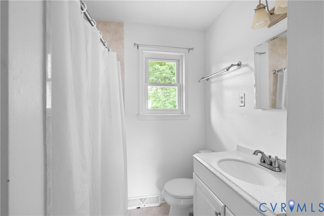 2713 Irwin Road Prince George, VA 23875 - Photo 13 of 26 a bathroom with a sink toilet and mirror