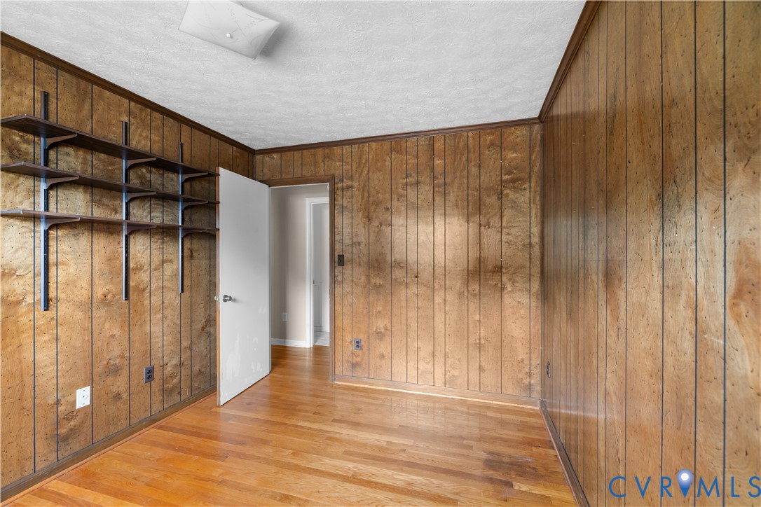 2713 Irwin Road Prince George, VA 23875 - Photo 14 of 26 a view of a hallway with wooden walls