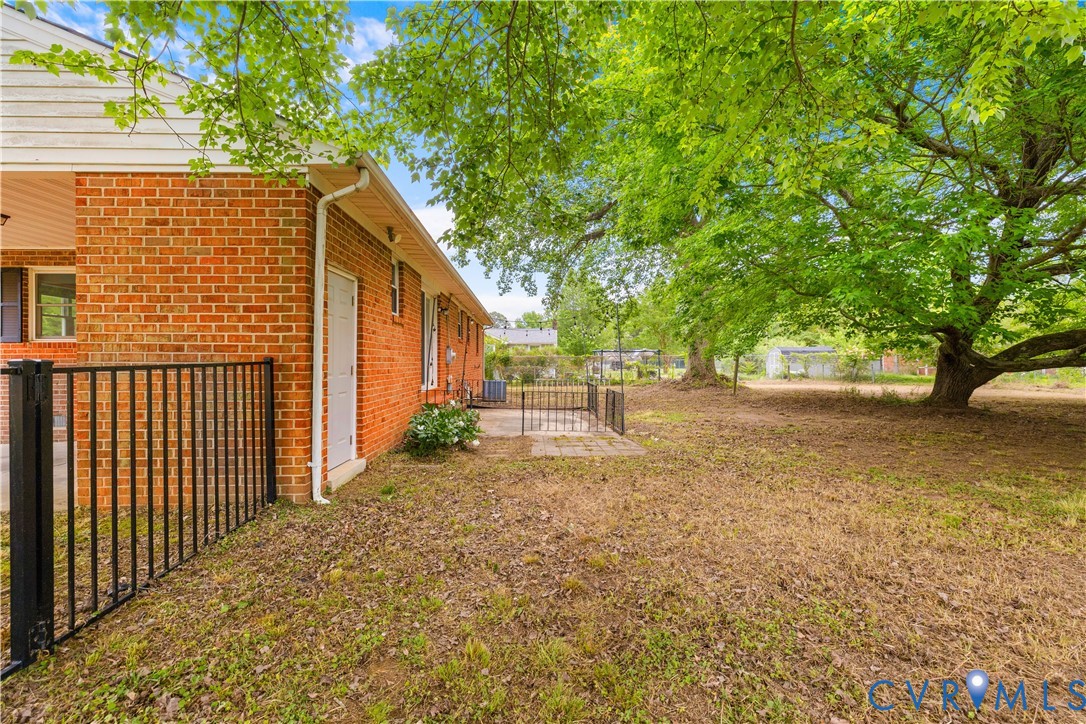 2713 Irwin Road Prince George, VA 23875 - Photo 17 of 26 a backyard of a house with lots of green space