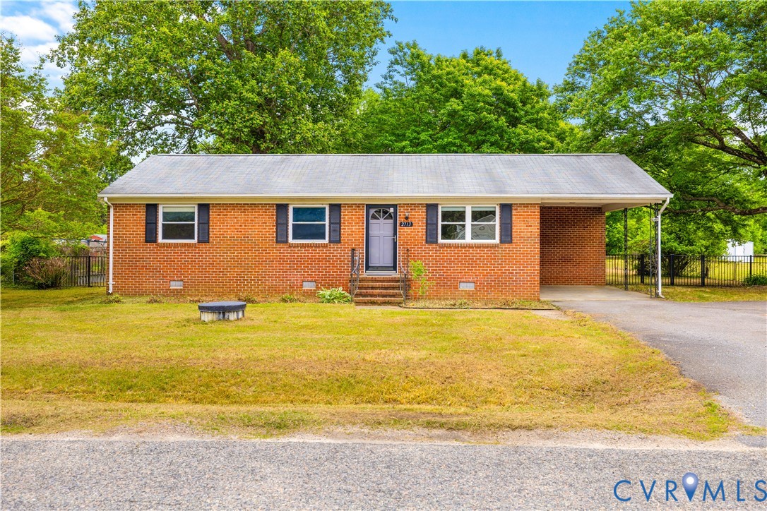 2713 Irwin Road Prince George, VA 23875 - Photo 2 of 26 a front view of a house with a garden