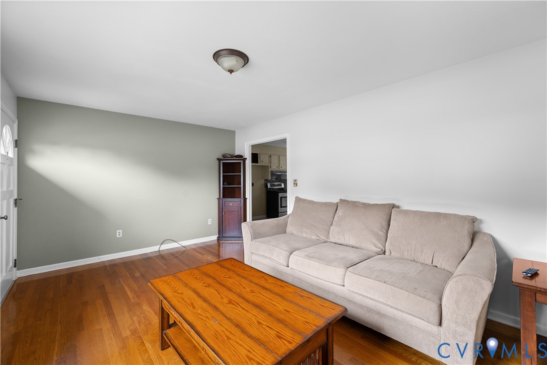 2713 Irwin Road Prince George, VA 23875 - Photo 4 of 26 a bedroom with a bed and couch