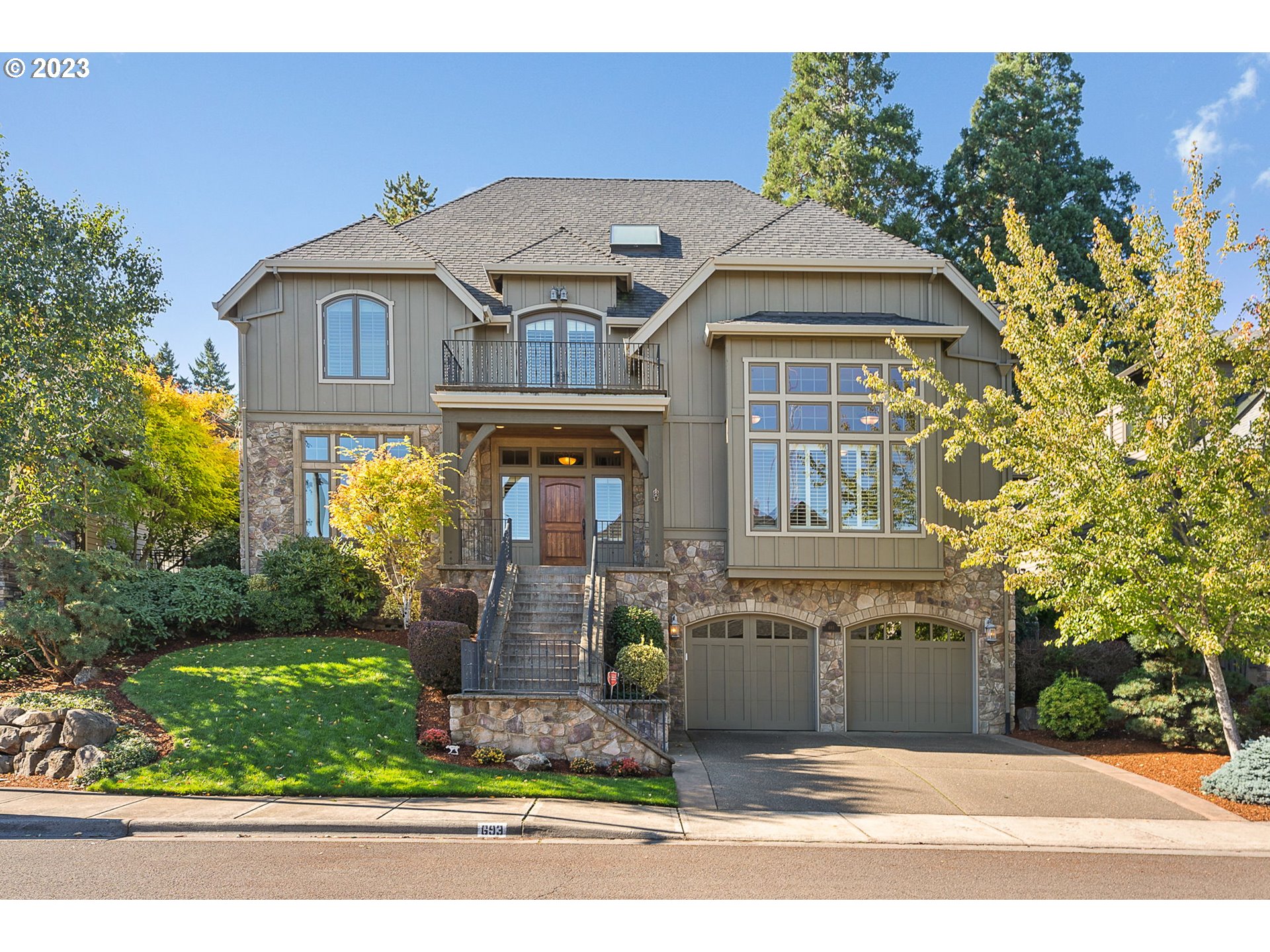 a front view of a house with garden