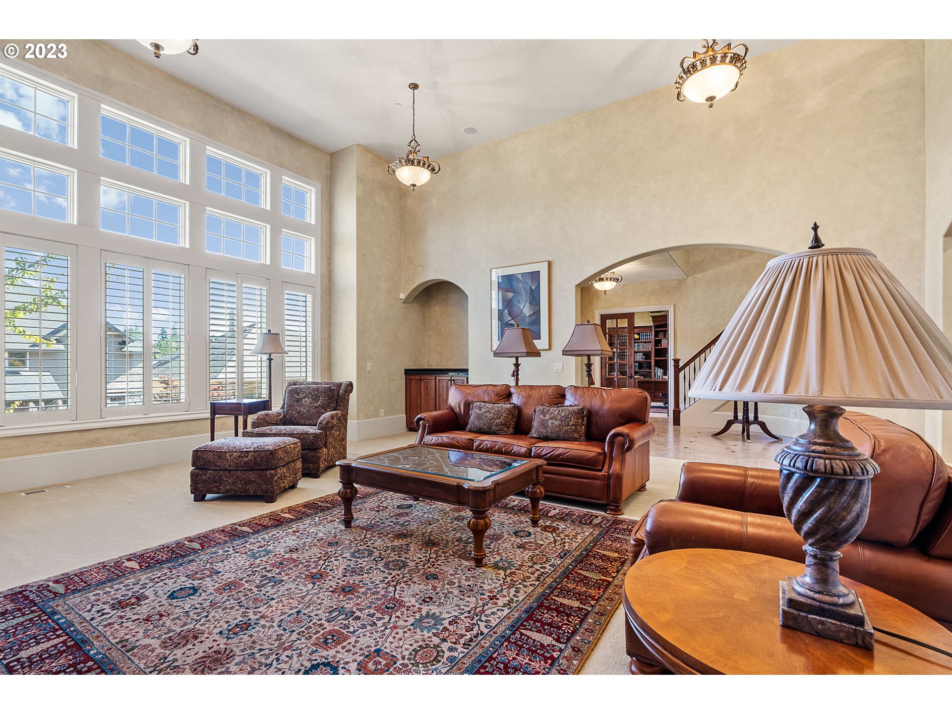 693 Southwest 68th Terrace Portland, OR 97225 - Photo 11 of 48 a living room with furniture a bathtub and a chandelier