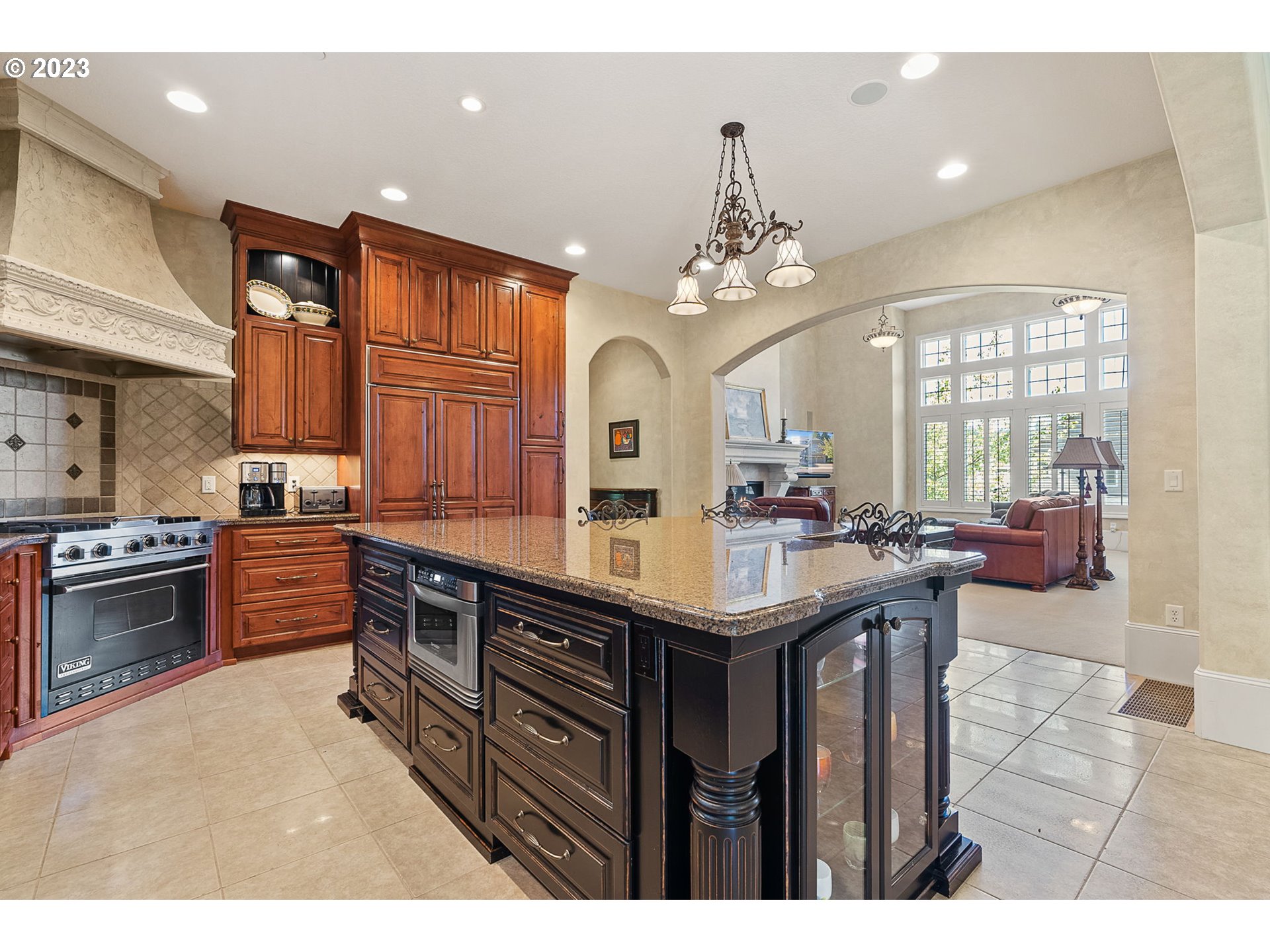 693 Southwest 68th Terrace Portland, OR 97225 - Photo 13 of 48 a kitchen with stainless steel appliances granite countertop a stove a sink dishwasher and a wooden cabinets