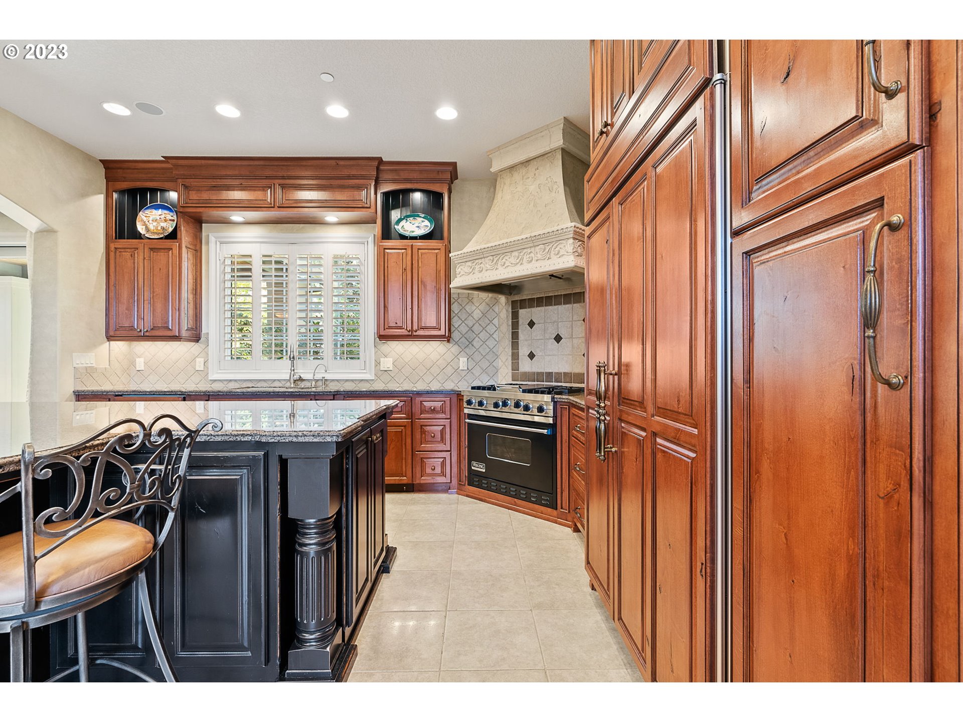 693 Southwest 68th Terrace Portland, OR 97225 - Photo 18 of 48 a kitchen with stainless steel appliances granite countertop a stove a sink and a refrigerator